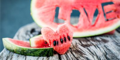 fresh-juicy-watermelon-slice-closeup-with-love-letters-word