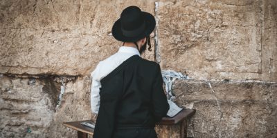 religious-orthodox-jew-praying-western-wall-reads-torah-jerusalem-old-city-orthodox-jews